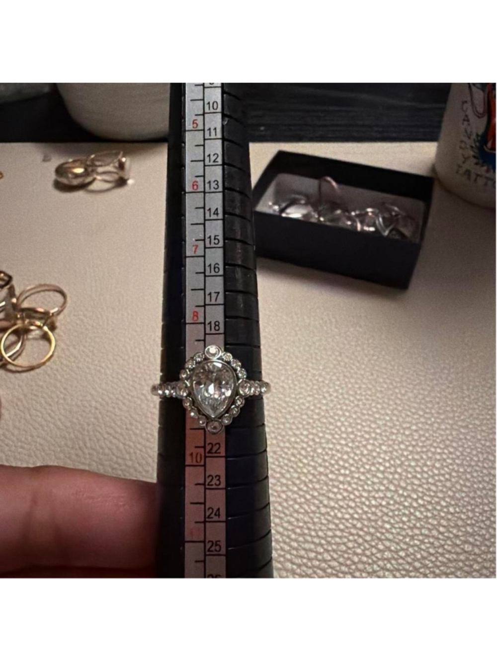 Size 9 Deco style Silver tone ring with a large central pear shape stone